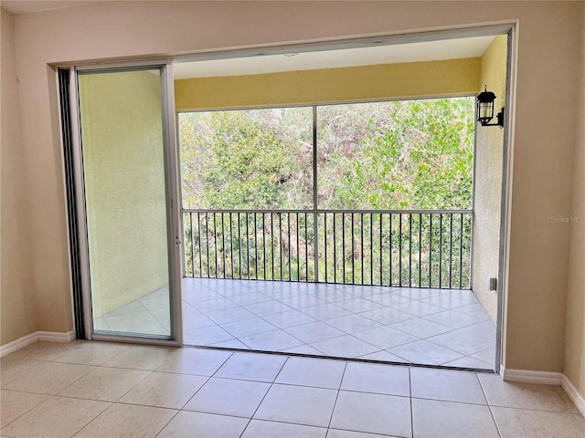 doorway to outside featuring light tile patterned floors