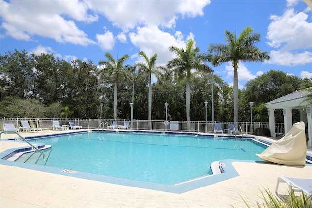5611 Key W Pl Unit 5611, Bradenton, FL 34203 - community pool with view of wooded area and a patio