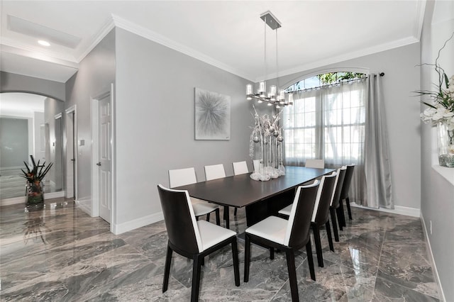 dining room featuring a notable chandelier and ornamental molding