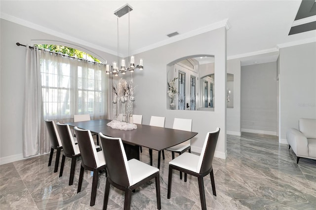 dining area featuring an inviting chandelier and crown molding