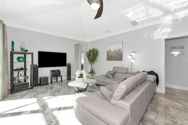 living room with ceiling fan and crown molding