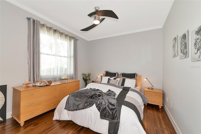 bedroom featuring dark hardwood / wood-style floors, ceiling fan, and ornamental molding