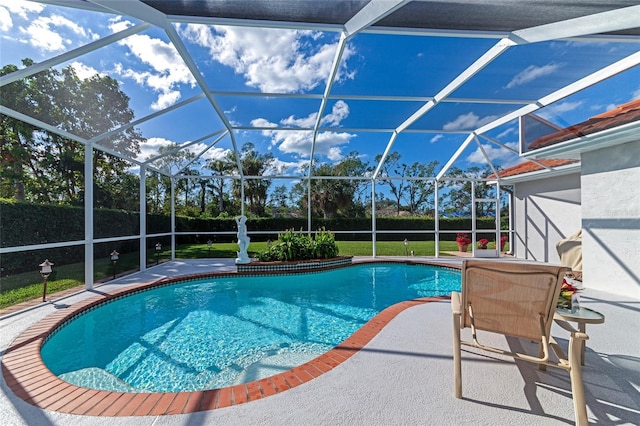 view of pool featuring a lanai, a patio area, and a lawn