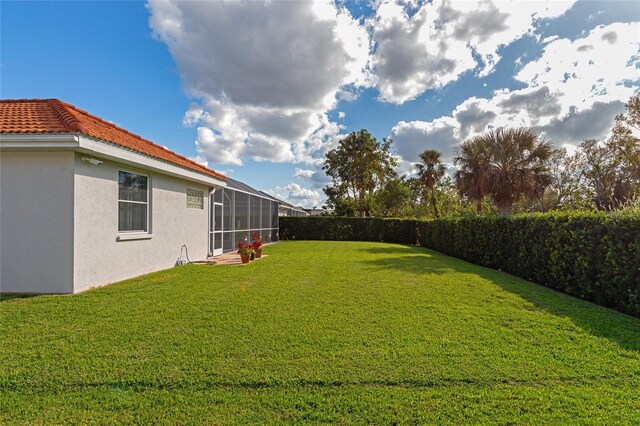 view of yard featuring a sunroom