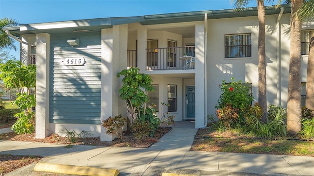 view of front of house featuring a balcony