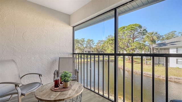 balcony featuring a water view