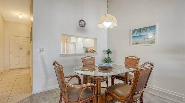 dining space featuring light hardwood / wood-style floors