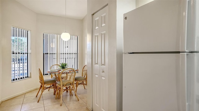 dining room with light tile patterned flooring