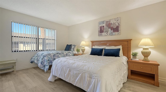 bedroom featuring light wood-type flooring