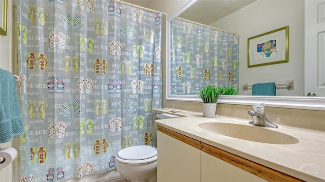 bathroom featuring vanity and toilet