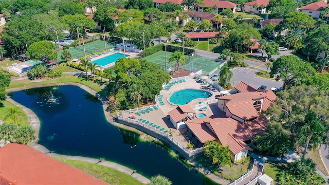 birds eye view of property with a water view