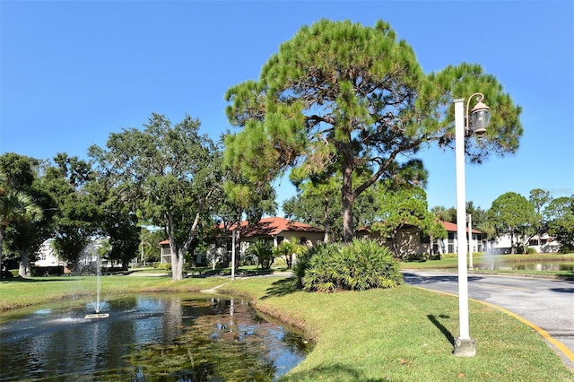 surrounding community with a water view