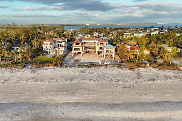 bird's eye view with a water view and a residential view