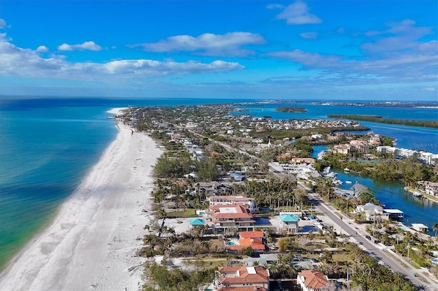 bird's eye view featuring a water view and a view of the beach