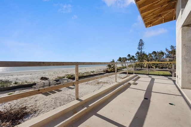 exterior space with a water view and a view of the beach