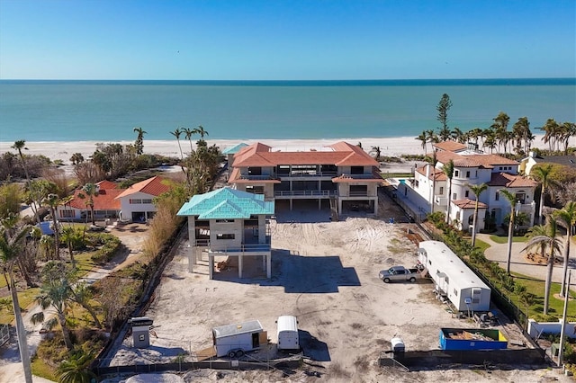 bird's eye view featuring a water view and a view of the beach