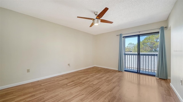 spare room featuring ceiling fan, light hardwood / wood-style floors, and a textured ceiling