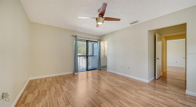 empty room with ceiling fan, a textured ceiling, and light hardwood / wood-style flooring