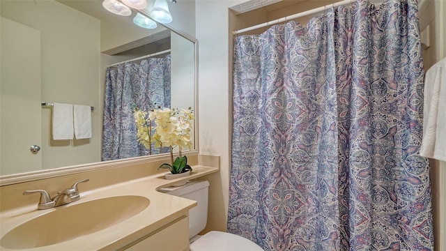 bathroom with vanity and toilet