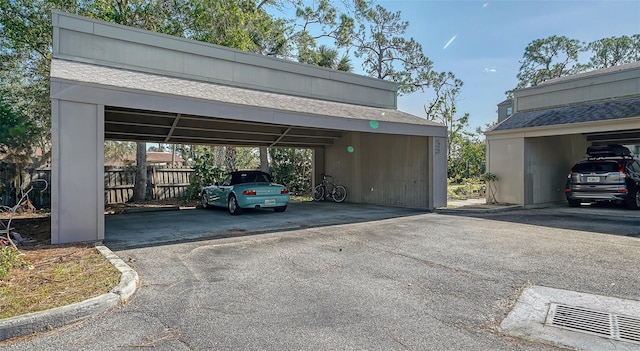 view of parking / parking lot featuring a carport