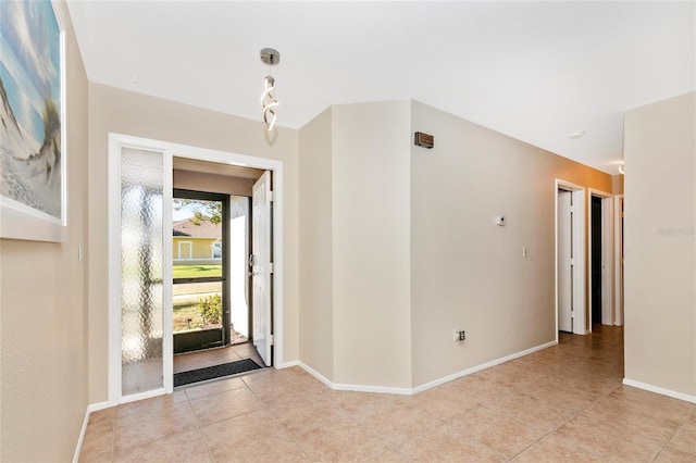 foyer entrance with light tile patterned flooring