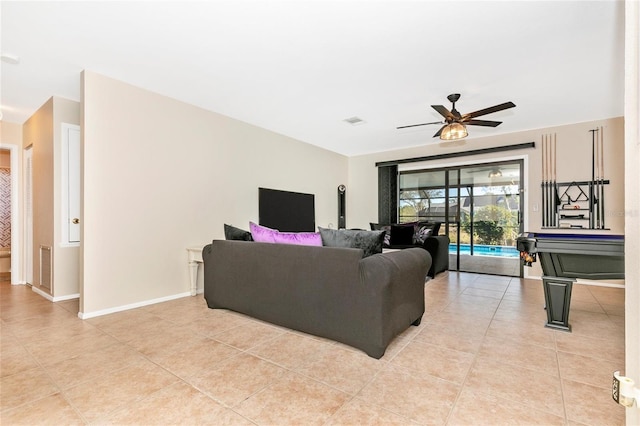 living room featuring ceiling fan and light tile patterned flooring