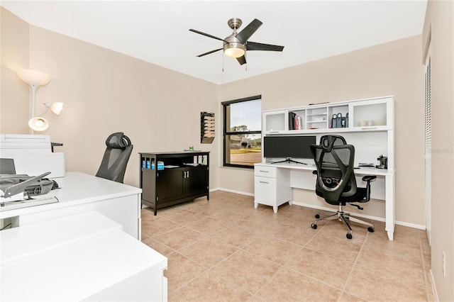 tiled home office featuring ceiling fan