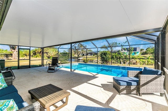 view of pool with a lanai and a patio area