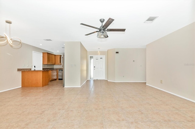 unfurnished living room with baseboards, visible vents, and a ceiling fan