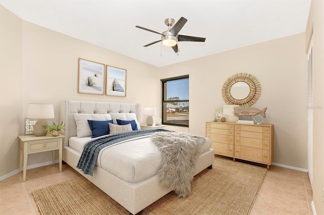 bedroom featuring ceiling fan and baseboards