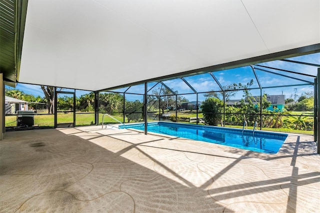 pool with a patio and a lanai