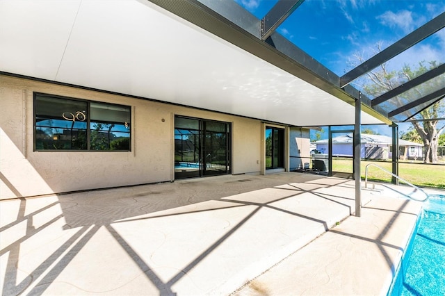 view of patio / terrace with a lanai and an outdoor pool