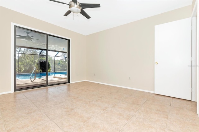 unfurnished room with ceiling fan, baseboards, and light tile patterned floors