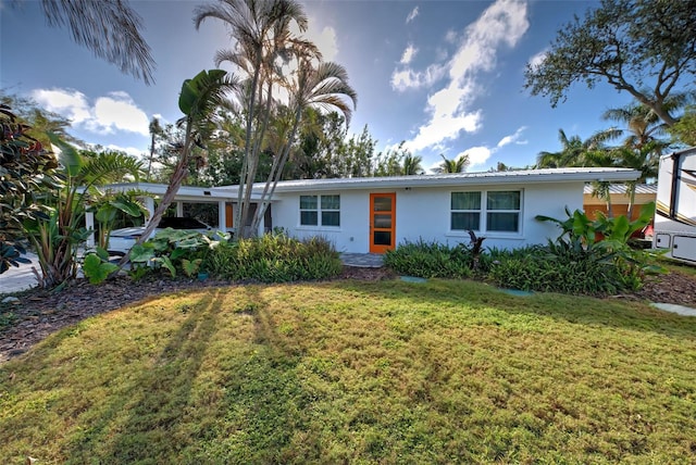 ranch-style house featuring a front lawn