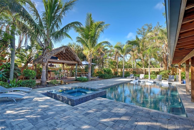 view of swimming pool featuring a gazebo, a patio area, and an in ground hot tub