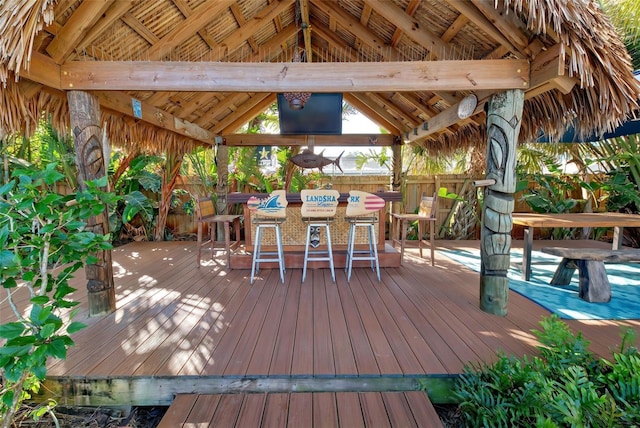 wooden deck featuring a gazebo and exterior kitchen