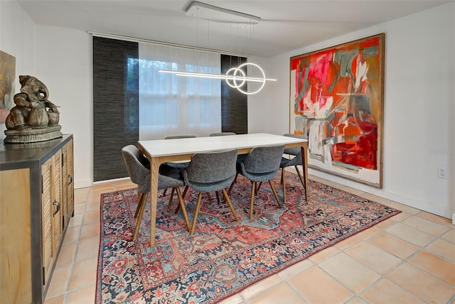 dining space with tile patterned flooring