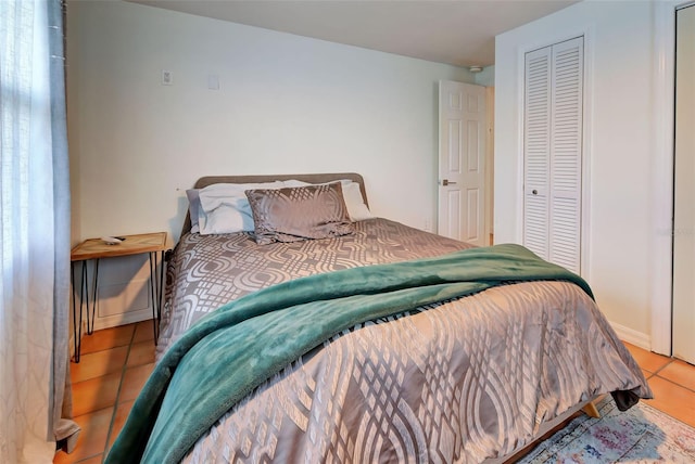 bedroom featuring light tile patterned flooring and a closet