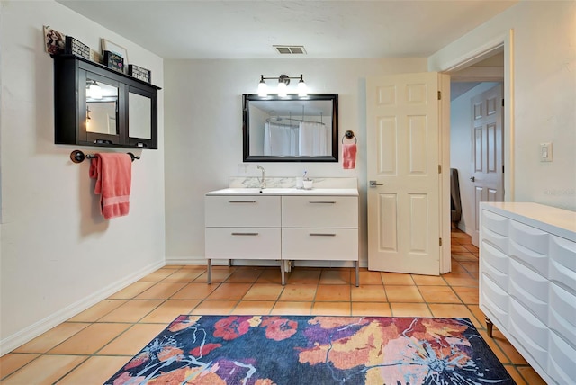 bathroom featuring tile patterned floors and vanity