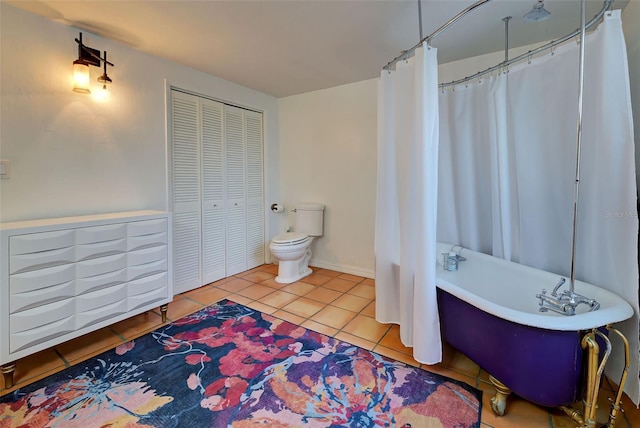 bathroom featuring tile patterned floors and toilet