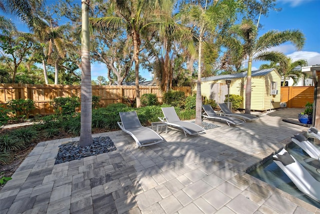 view of patio with a storage unit