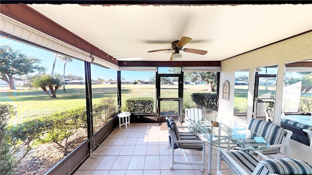 sunroom with a wealth of natural light and ceiling fan