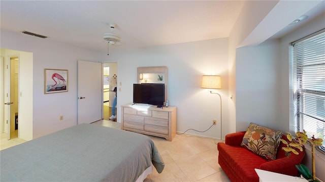 tiled bedroom with ceiling fan