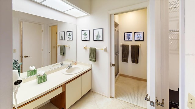 bathroom with vanity, tile patterned floors, and walk in shower