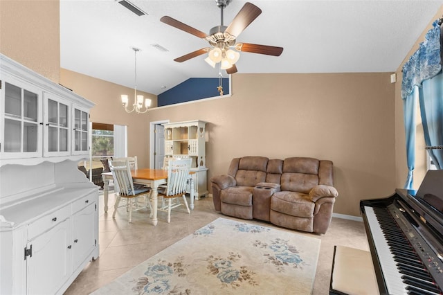 tiled living room featuring high vaulted ceiling and ceiling fan with notable chandelier