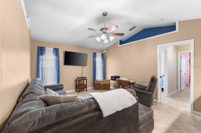 tiled living room with ceiling fan and vaulted ceiling