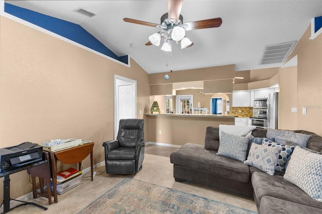 tiled living room with ceiling fan and lofted ceiling