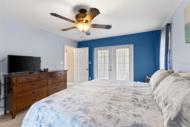 bedroom with light carpet, french doors, access to exterior, a textured ceiling, and ceiling fan