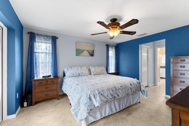 bedroom featuring ceiling fan and light tile patterned flooring