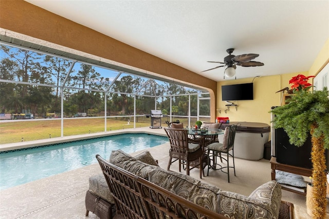 view of swimming pool featuring an outdoor hangout area, a lanai, a patio area, and ceiling fan